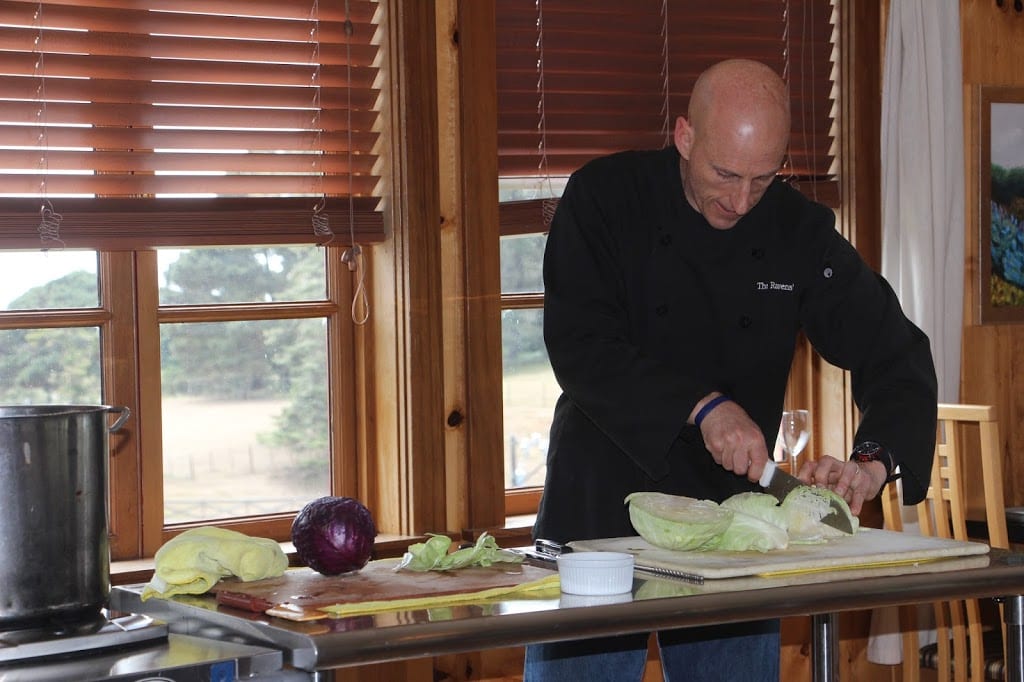 Sid demonstrating knife skills with the cabbage