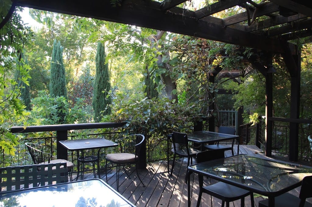 Outdoor deck overlooking the gardens at Eden Vale Inn