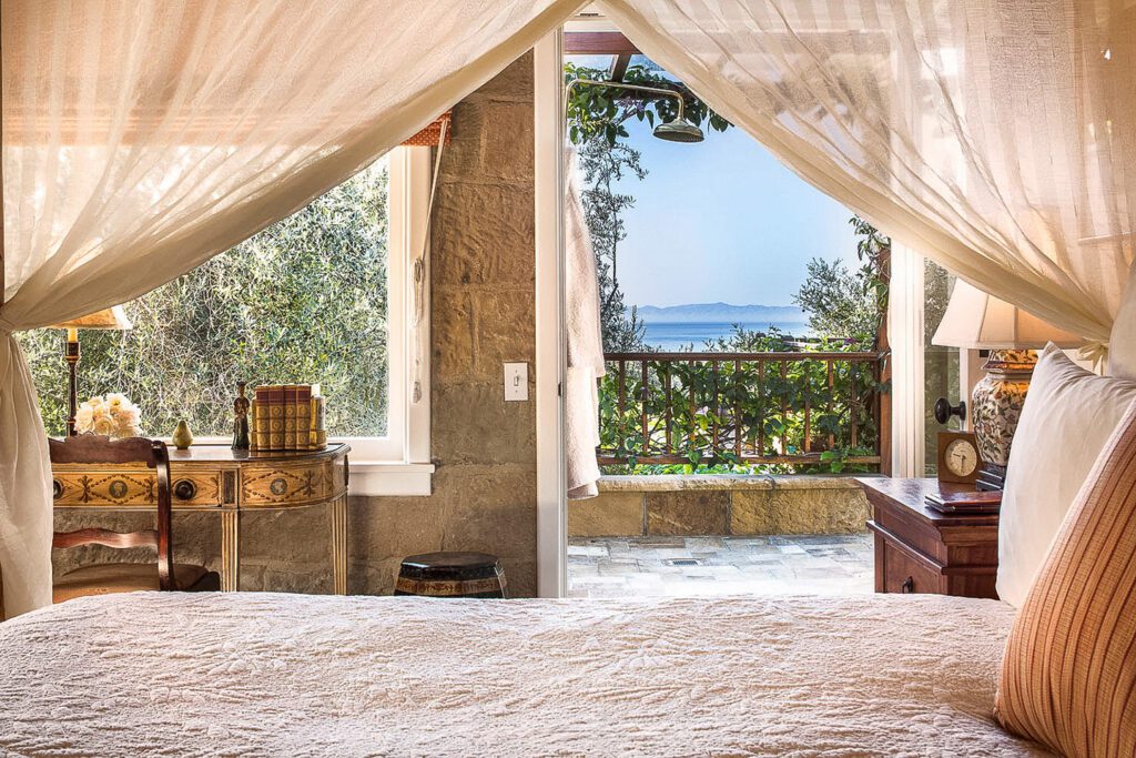 Ocean views from the canopy bed of the Kennedy Cottage at San Ysidro Ranch