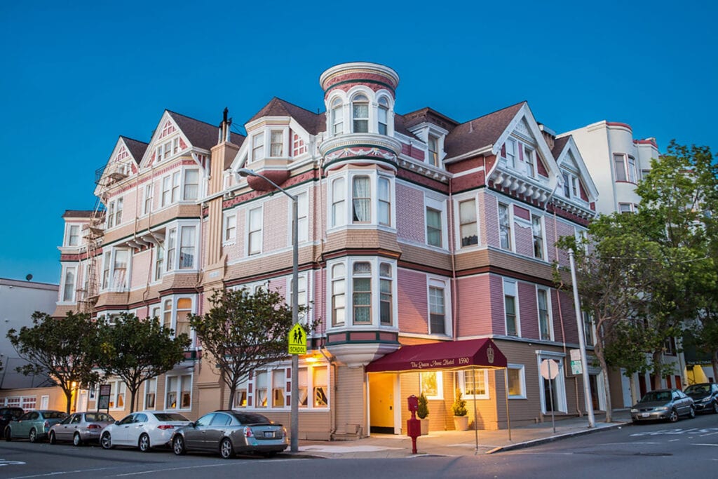 Exterior of the Queen Anne Hotel at dusk