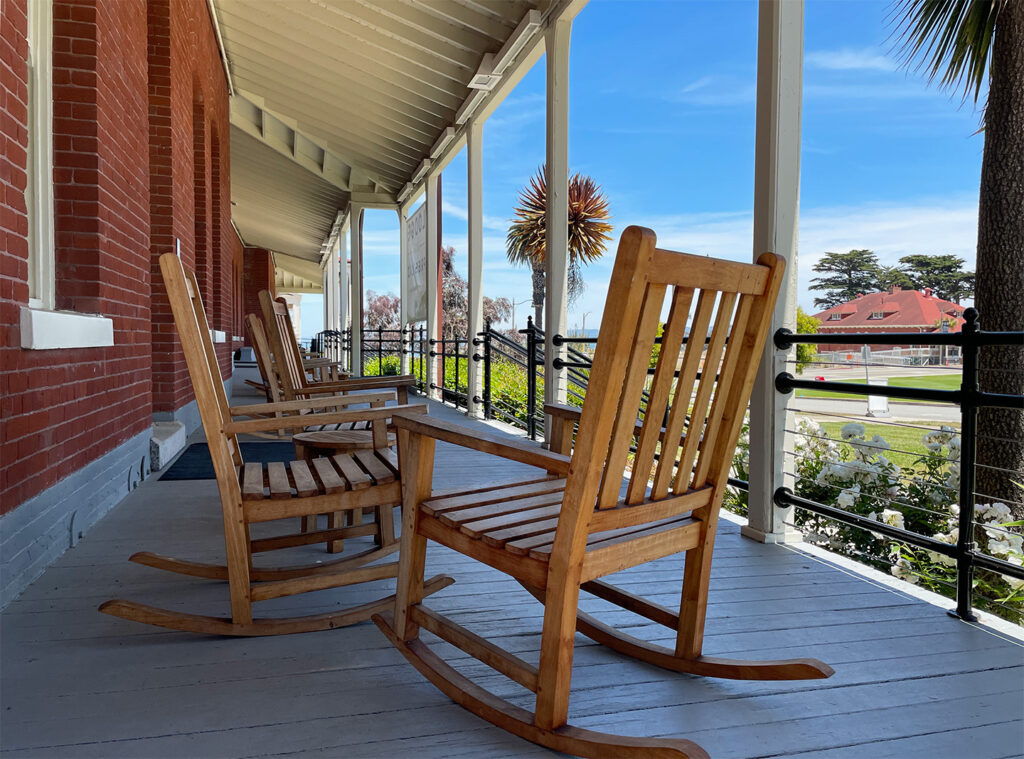 Rocking chairs on the front porch of the Lodge at the Presidio
