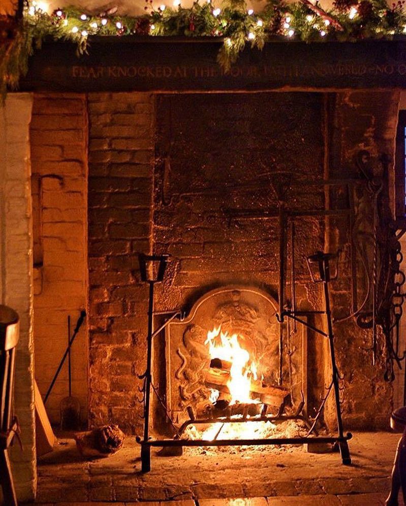 Recessed inglenook fireplace inside the dining room of The Pelican Inn