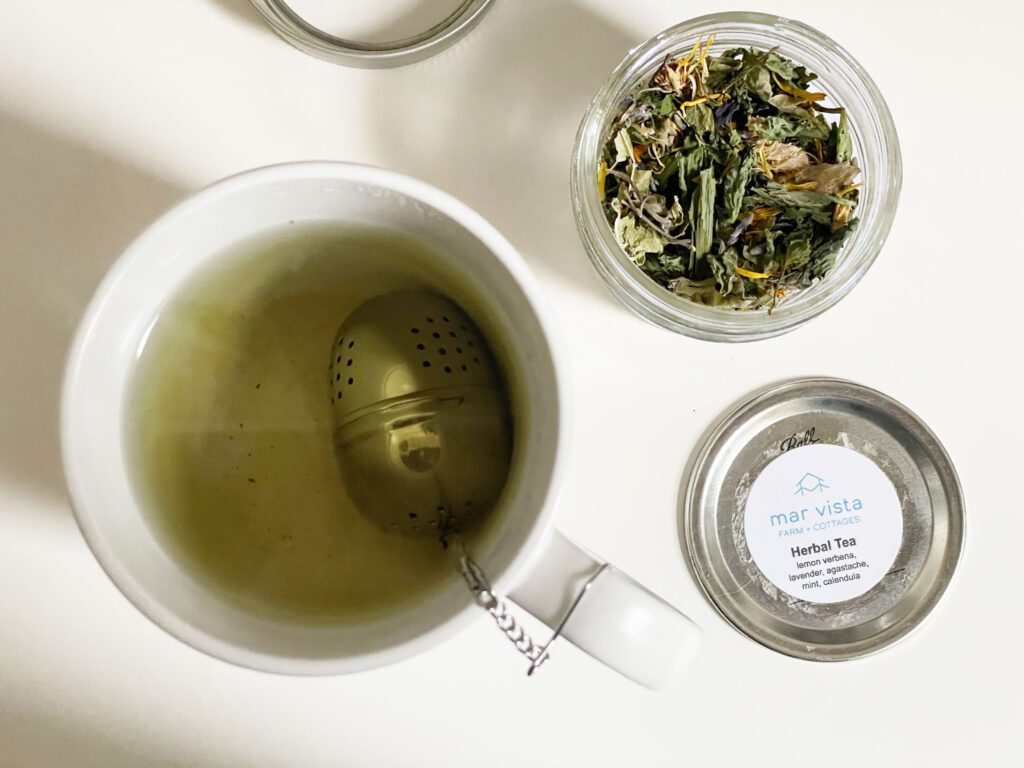 Steeping cup of tea and tea leaves