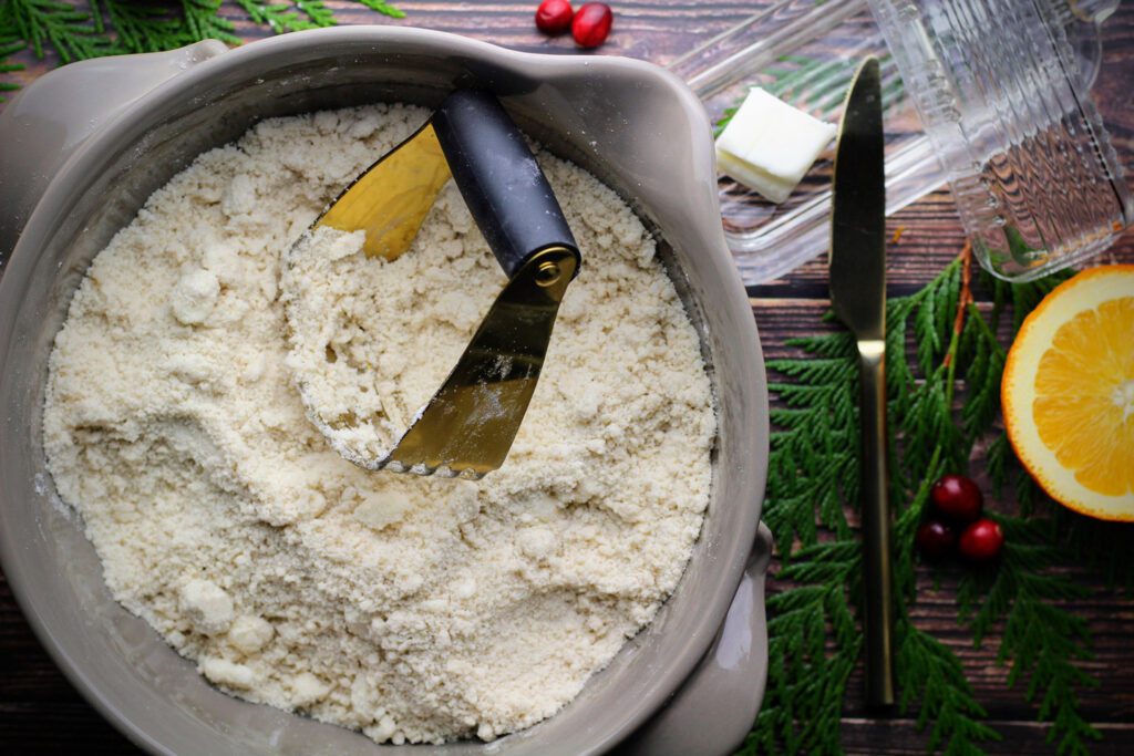 Mix the dry ingredients together in a large bowl, then cut in the cold butter