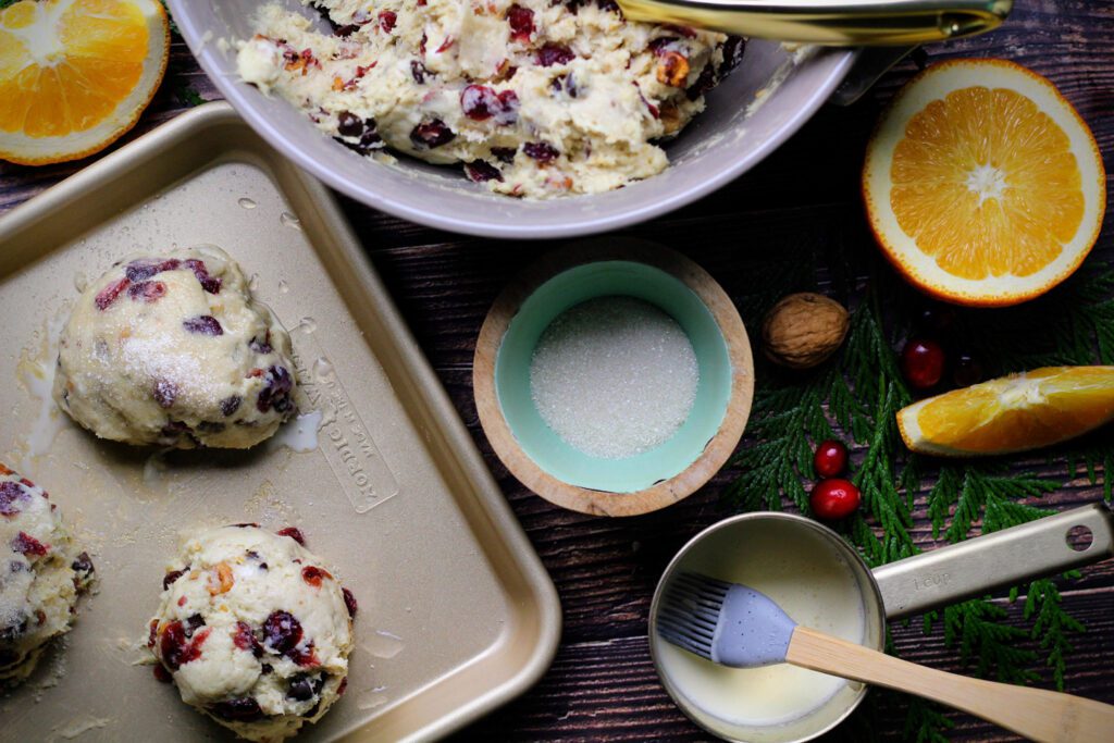 Scoop the scones onto a greased baking sheet, then brush with cream and sprinkle with sugar