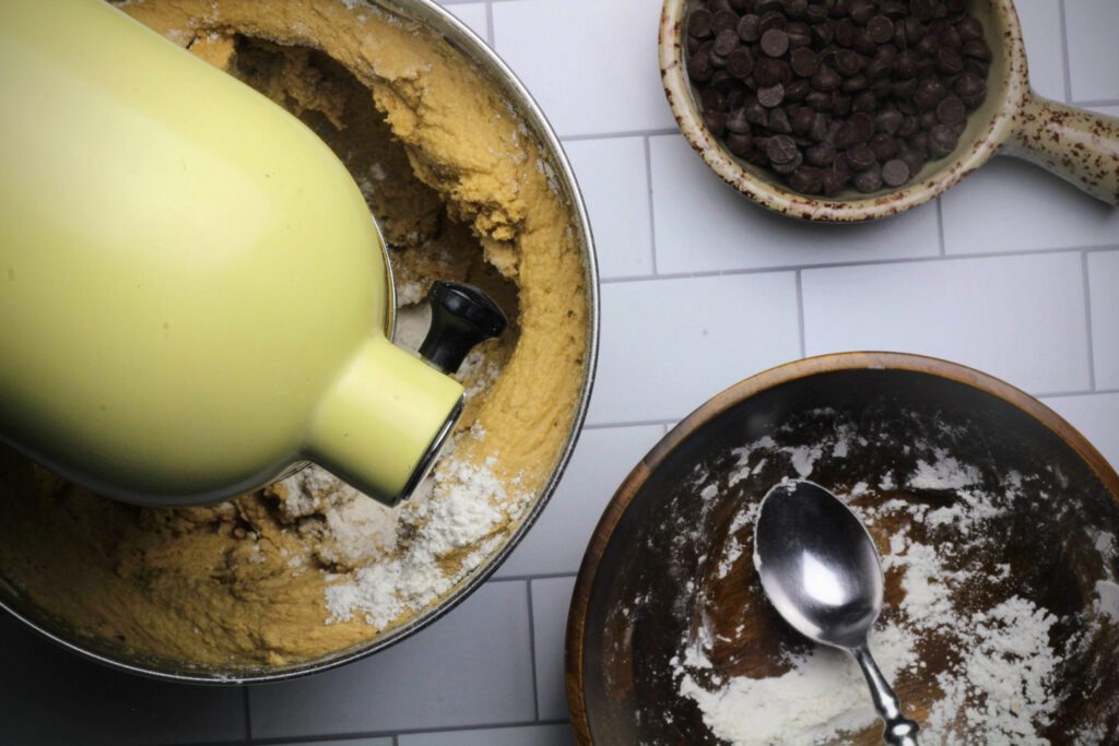 Mixing the dry ingredients into the cookie dough batter