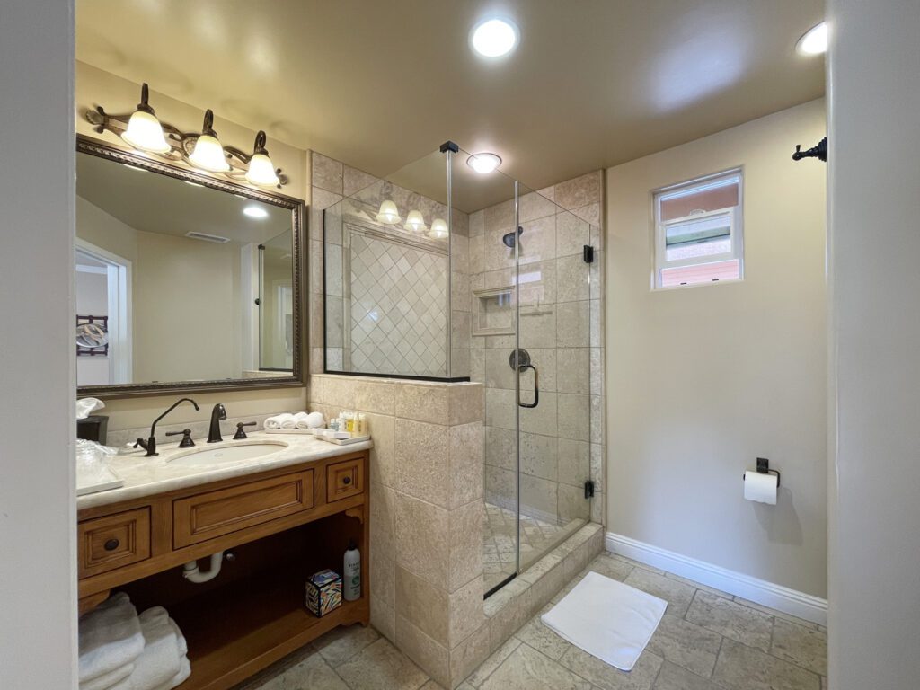Travertine tile bath of the Rhapsody Suite.
