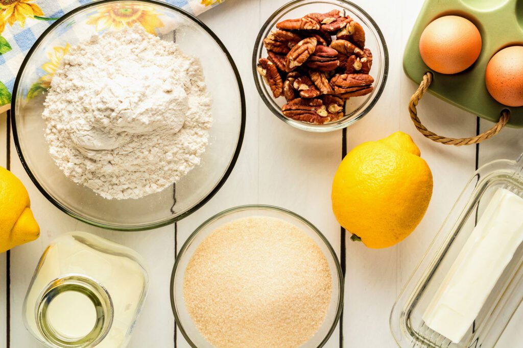 flour, pecans, eggs, butter, lemon, sugar, and milk