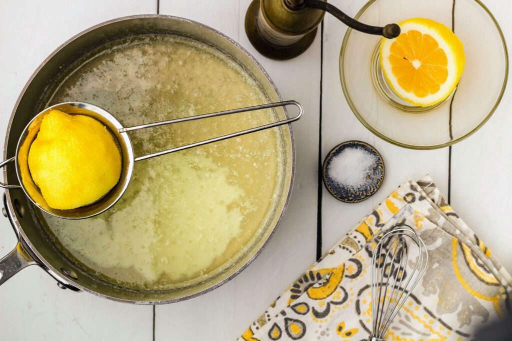 Squeezing lemon juice in to the melted butter