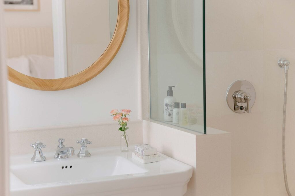 Guest room bath at Cara Hotel