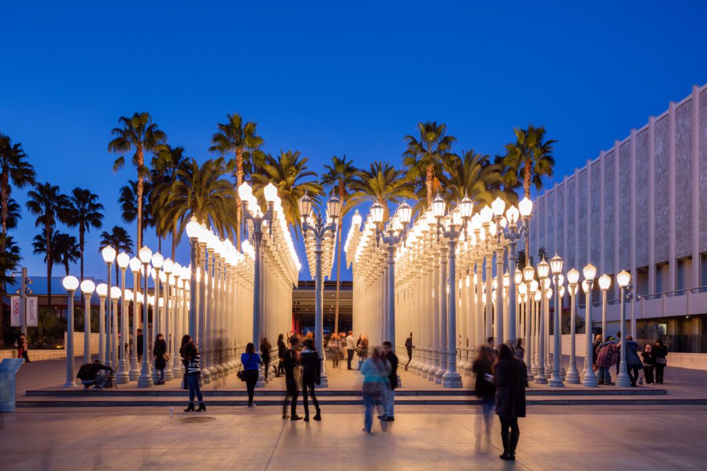 "Urban Light" installation by Chris Burden which is a well-known installation in at LACMA. The installation consists of 202 restored street lamps from the 1920s and 1930s. Most of them once lit the streets of Southern California.