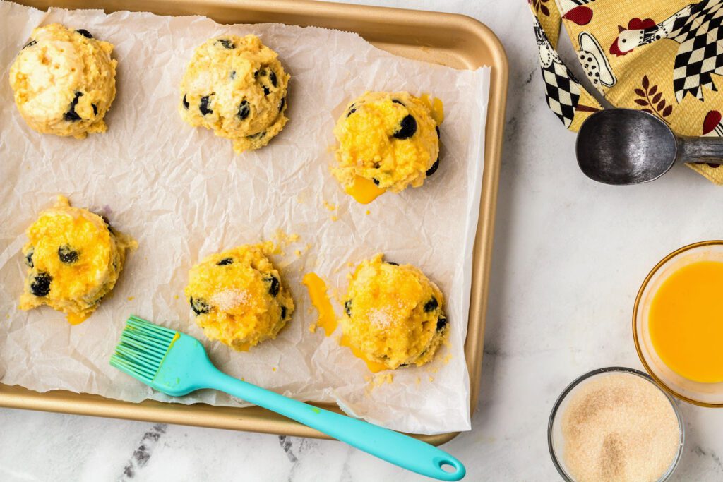 Scoops of dough on a baking sheet