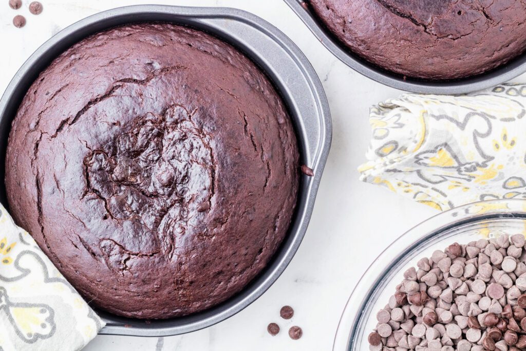 Baked cake layers cooling in pans