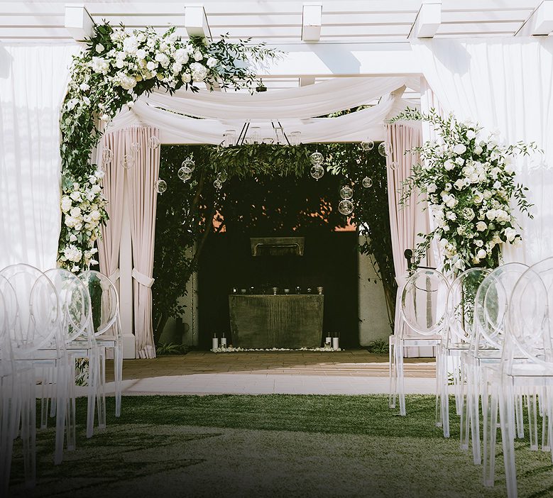 The terrace decorated with flowers for a wedding ceremony at Fess Parker Wine Country Inn & Spa