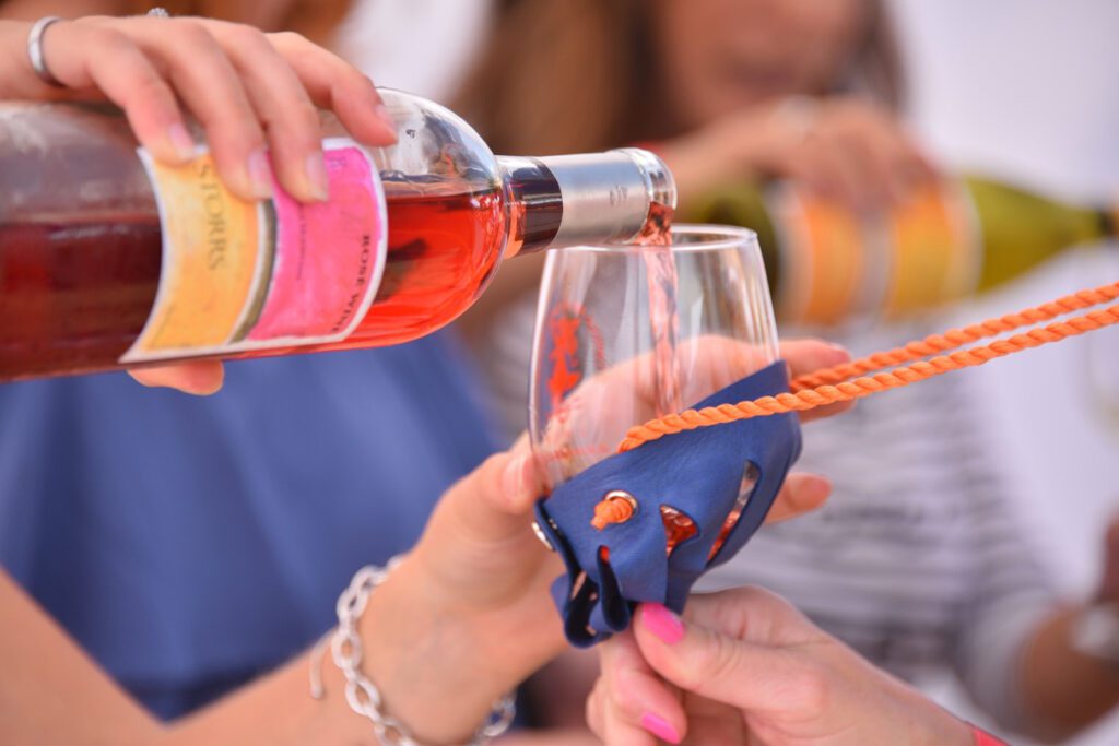 Pouring wine into a glass at the Capitola Art & Wine Festival