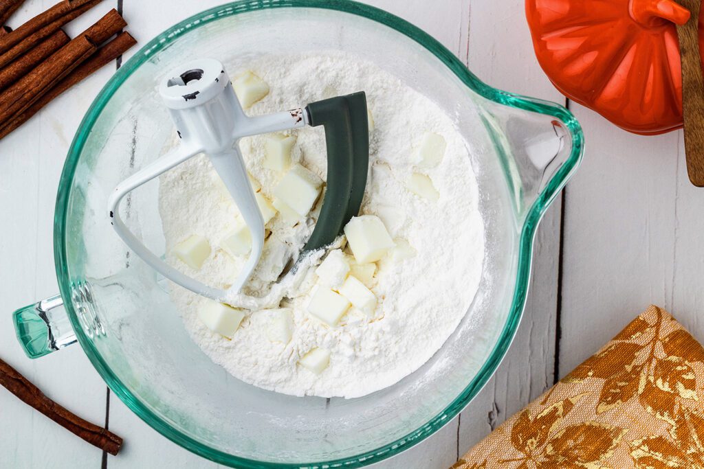 Cutting butter into the cake mix in a mixing bowl
