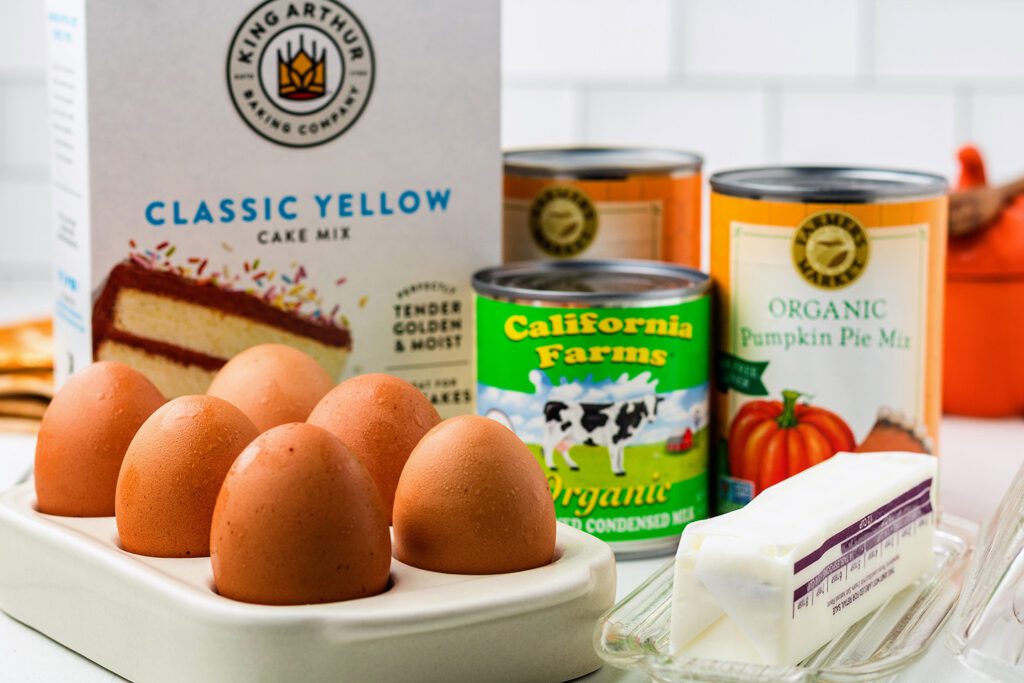 Eggs, yellow cake mix, pumpkin pie filling, sweetened condensed milk, and butter
