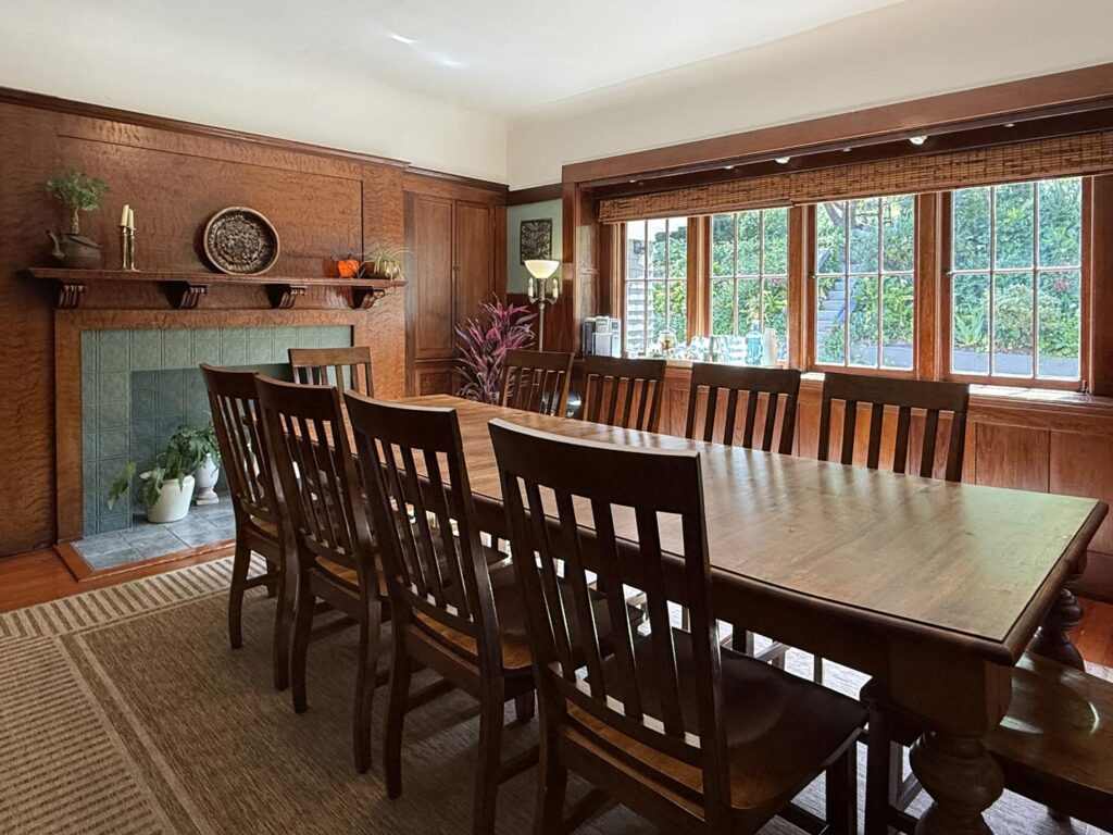 The dining room with its curly redwood fireplace mantel