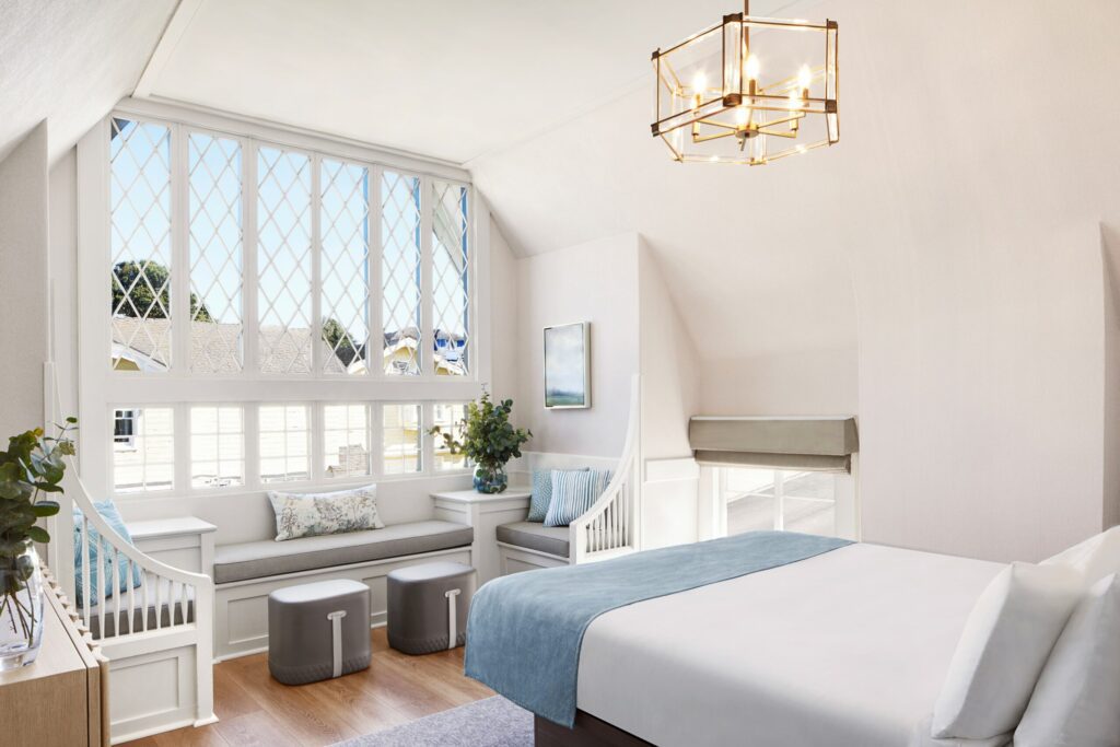 The Jennifer Room at the Green Gables Inn with large windows and a inviting window bench