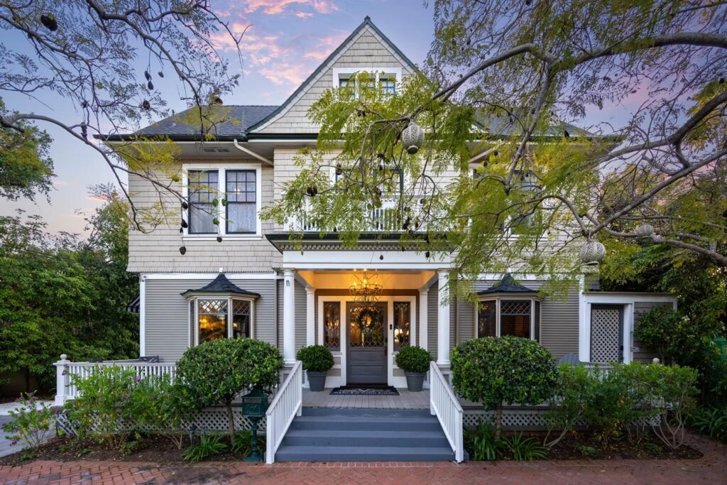 Exterior of De La Vina Inn at dusk