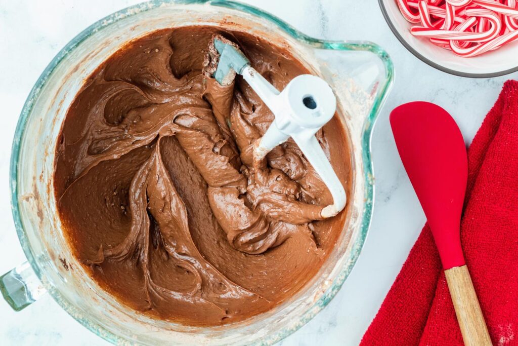 Brownie batter in a glass mixing bowl