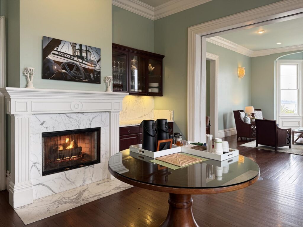 The dining room with a marble fireplace