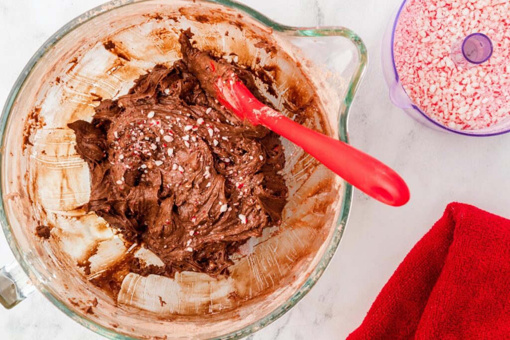 Folding crushed peppermint candies into the brownie batter