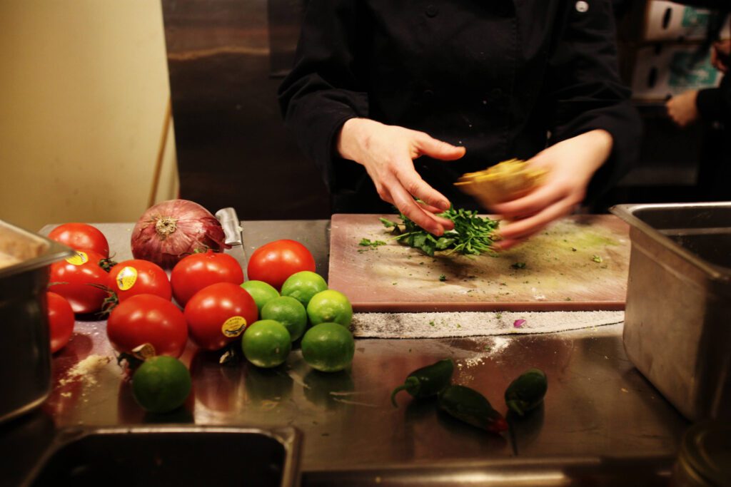Prepping in the kitchen at Raven's at the Stanford Inn by the Sea
