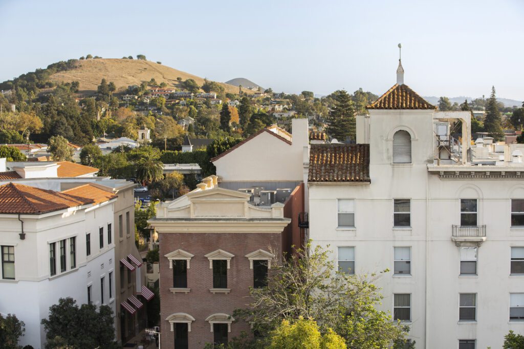 Aerial view of afternoon light shining on the historic buildings of the downtown core.