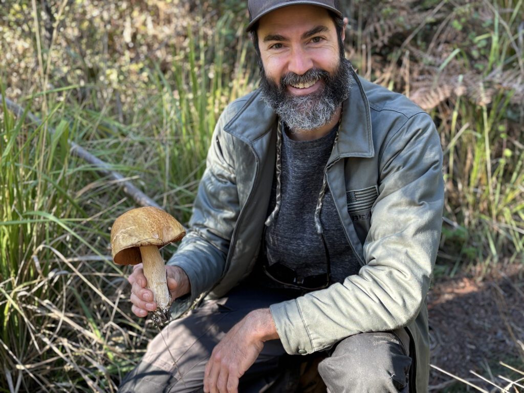 A man holding a mushroom