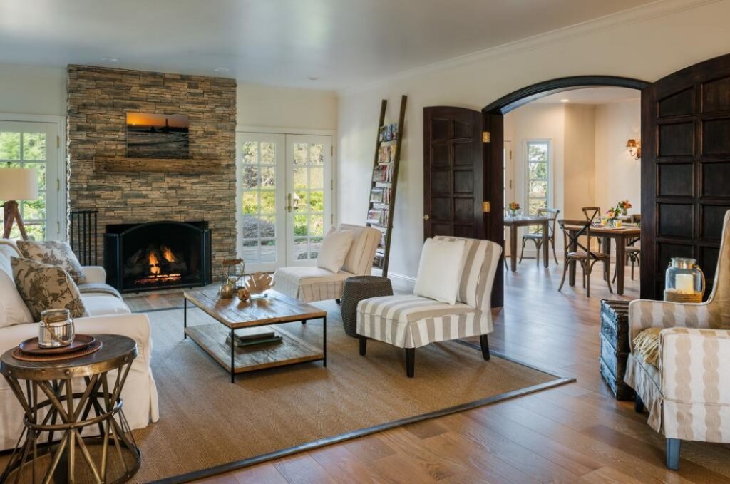 living room with a fireplace and contemporary, coastal inspired decor